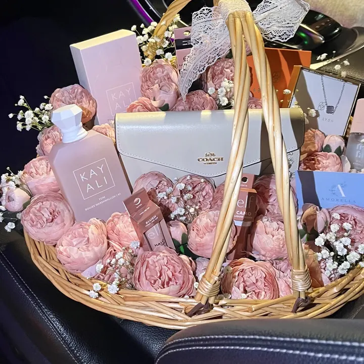 Pink rose gift basket with perfume and beauty gifts
