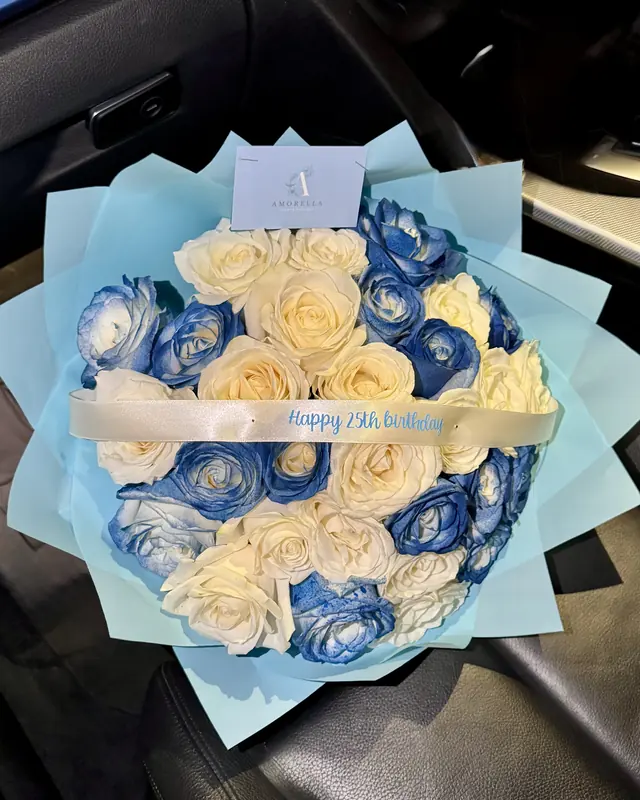 Blue and cream rose bouquet by Amorella Flower Boutique
