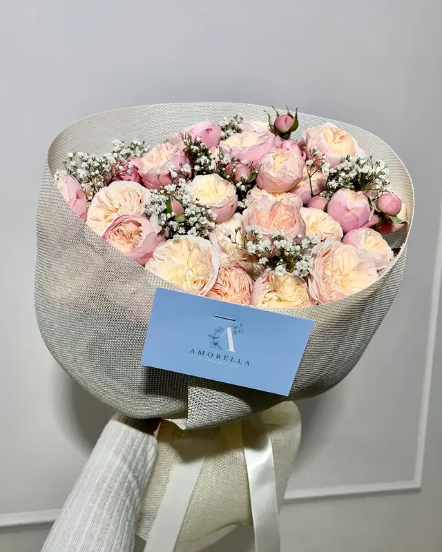 Pink rose bouquet in a clear wrap by Amorella Flower Boutique