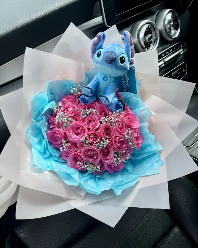 Pink rose bouquet with a Stitch toy by Amorella Flower Boutique