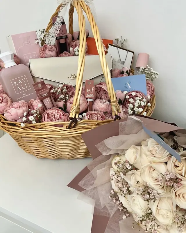Pink rose gift basket with a cream rose bouquet by Amorella Flower Boutique