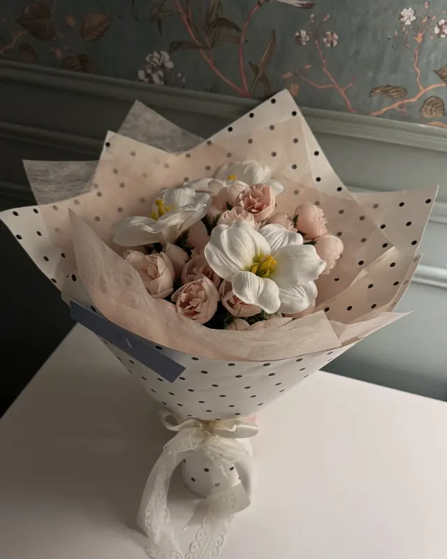 Pink and white flower bouquet in polka dot wrap by Amorella Flower Boutique
