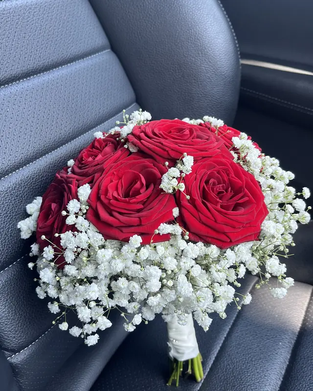 Red rose and gypsophila bridal bouquet by Amorella Flower Boutique