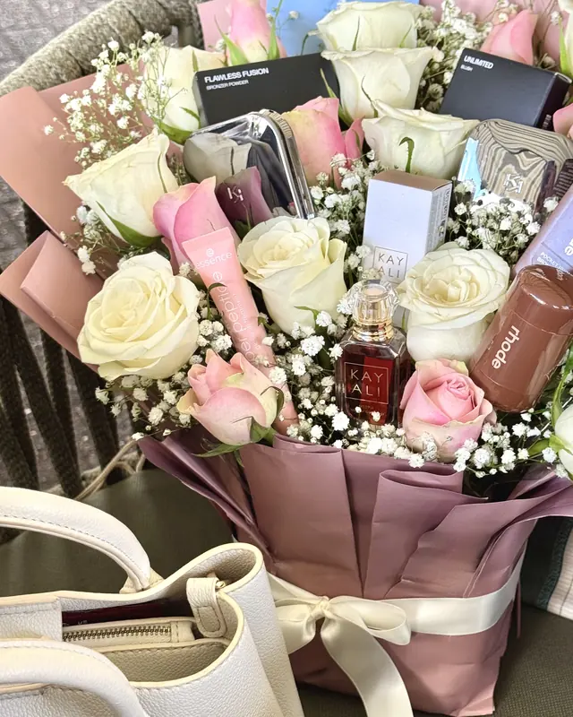 Rose bouquet with beauty gifts by Amorella Flower Boutique