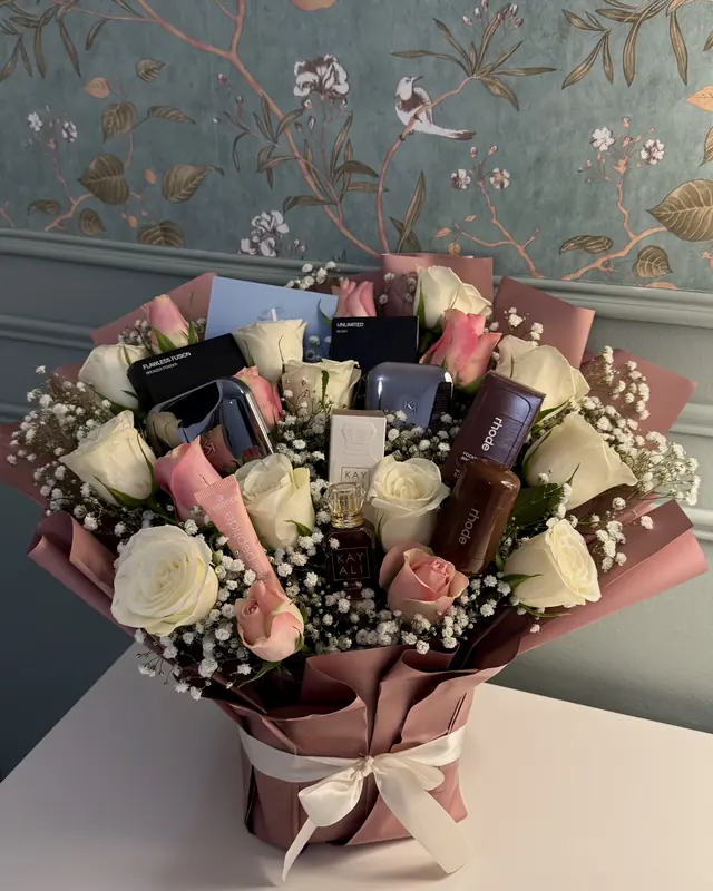 Rose bouquet with perfume and makeup gifts by Amorella Flower Boutique