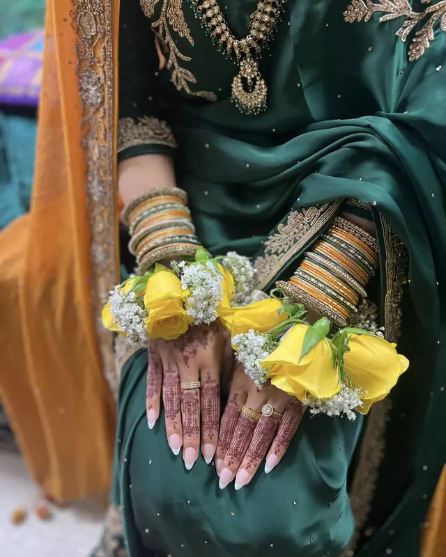 Yellow rose and gypsophila gajras by Amorella Flower Boutique